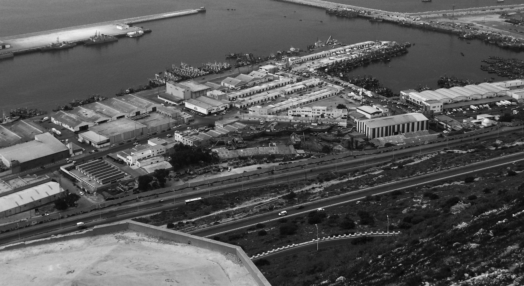 Aerial view of a port with rail lines and maritime infrastructure